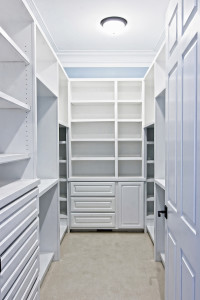 large white walk-in closet with shelves