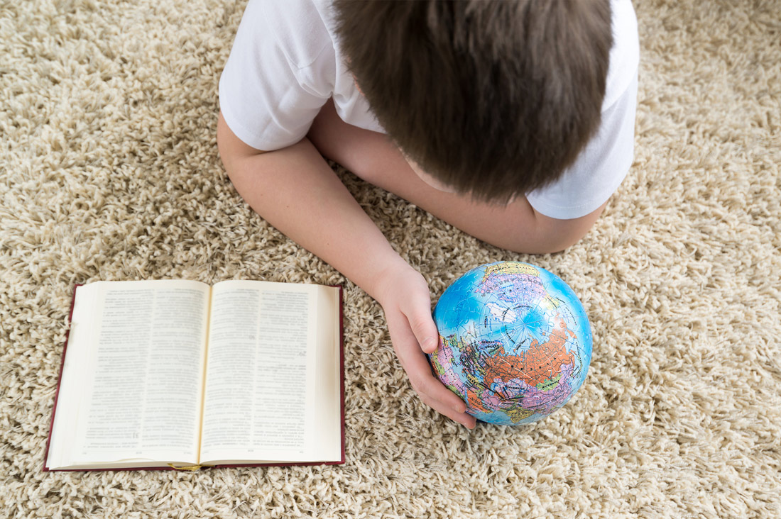 boy-studing-on-carpet